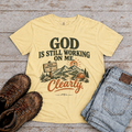 "God is still working" T-Shirt